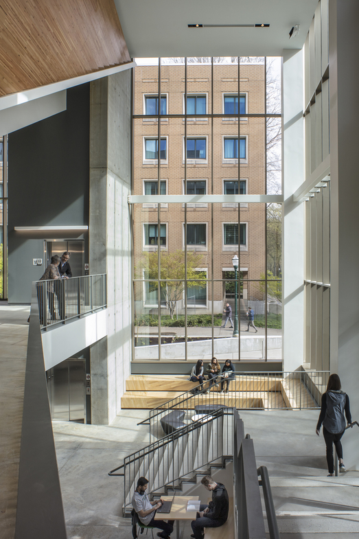 picture of the interior of a building with windows on two sides and stairways