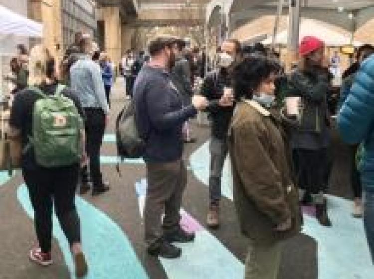 People gathered under a canopy