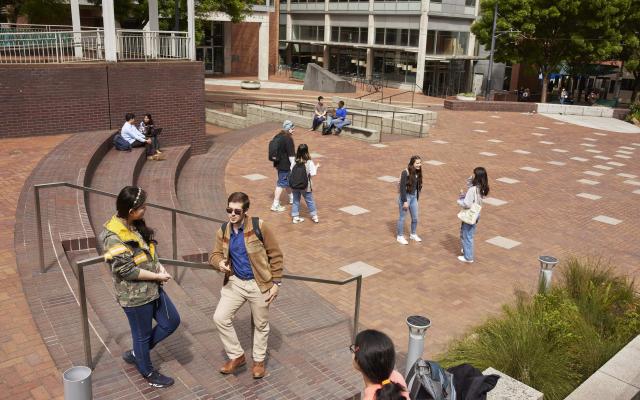 picture of students in a brick plaza