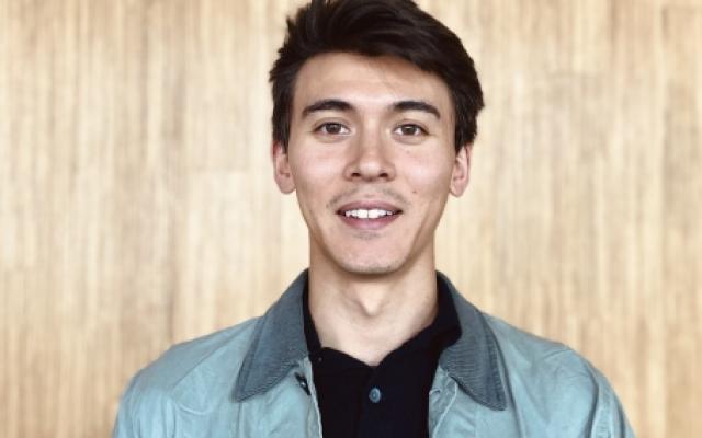 picture of Ryan Al-Schamma on a light brown background