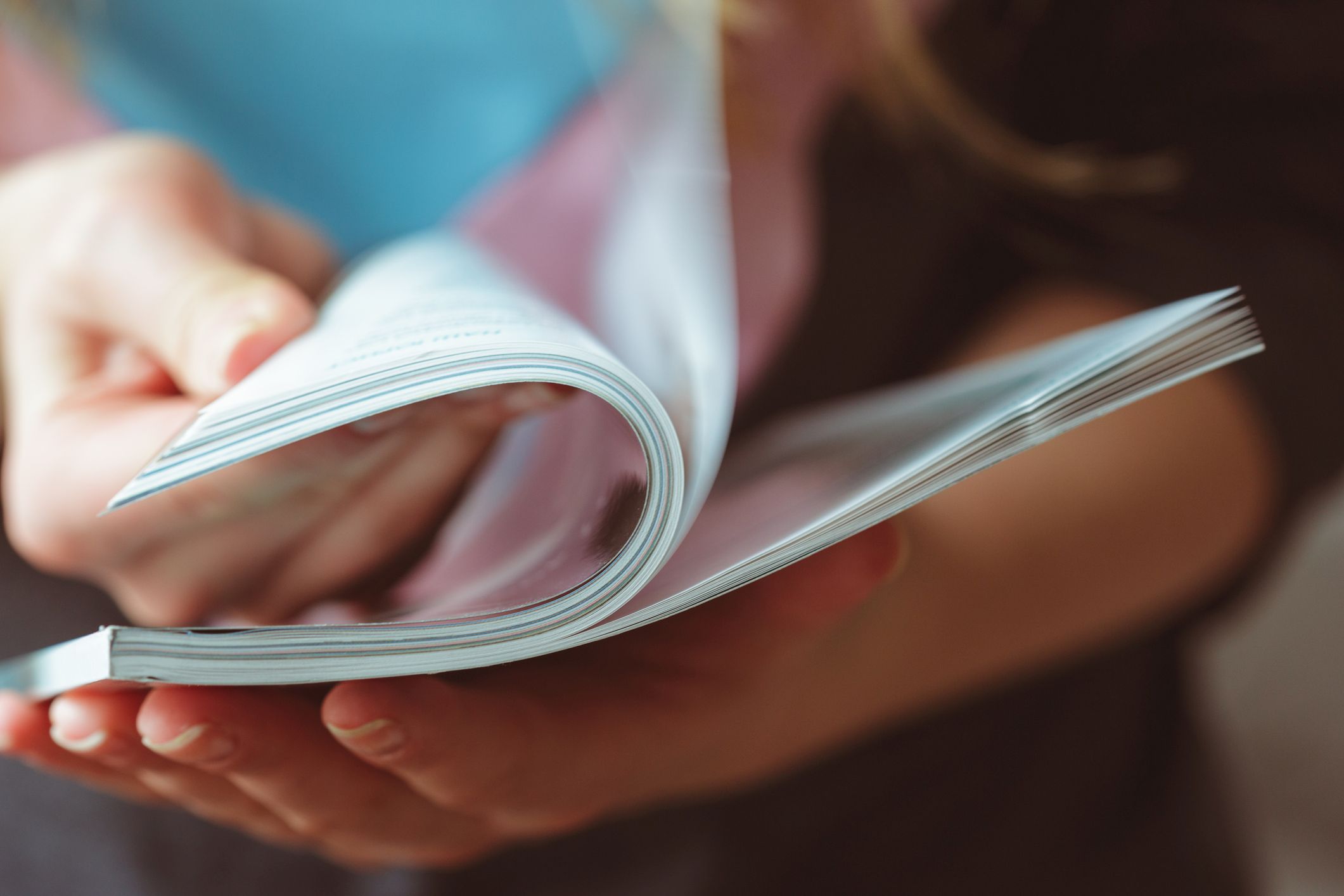 Person reading a booklet