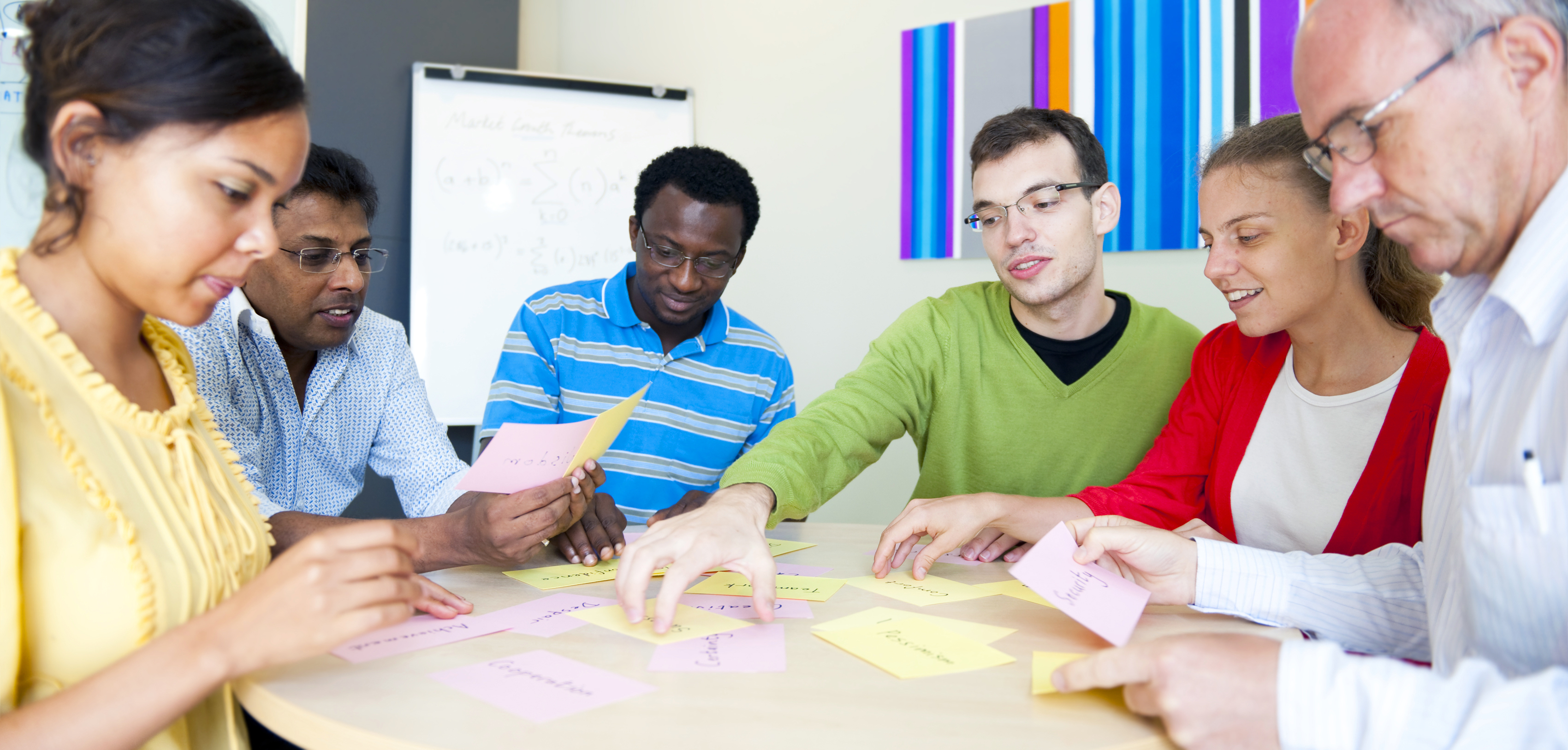 Diverse group of students working together at a table