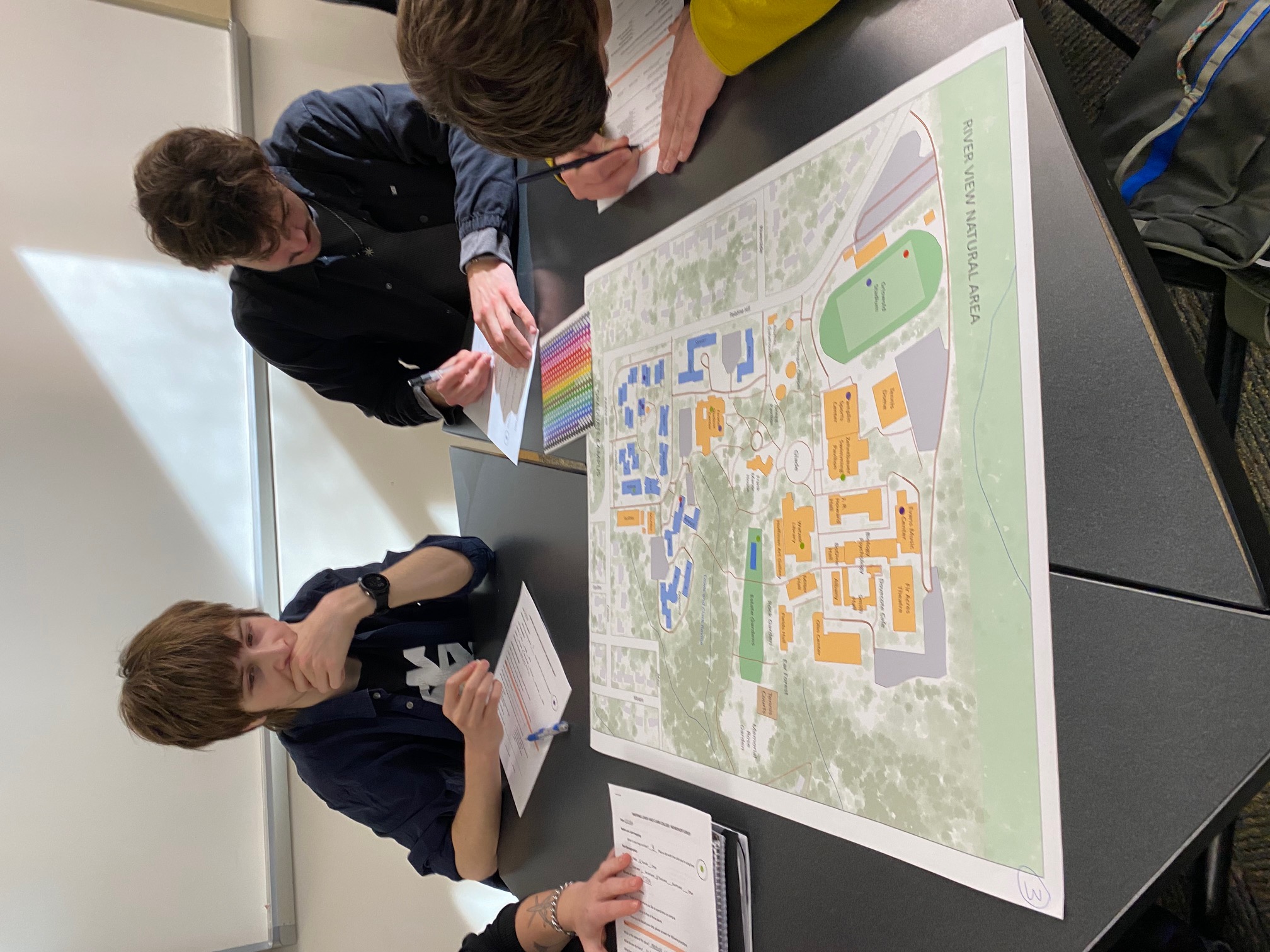 Lewis & Clark students review a map of Lewis & Clark College's campus.