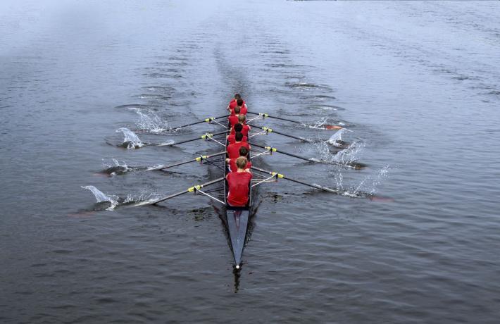 Rowing crew slicing through the water