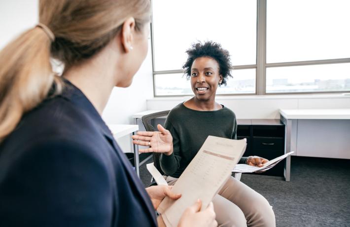Two women speaking in a focus group