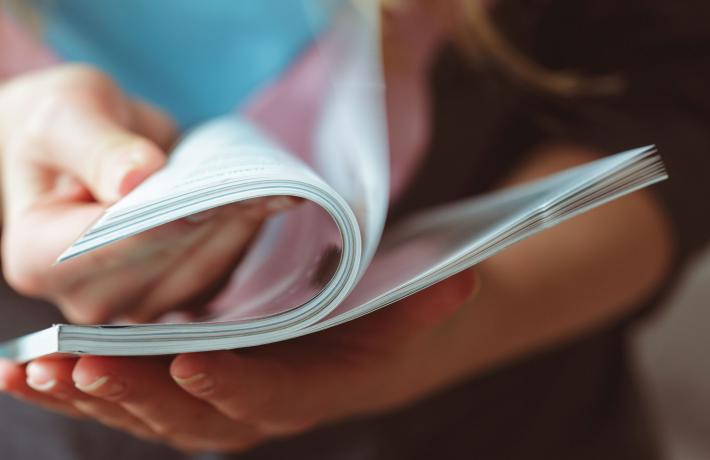 Person reading a booklet