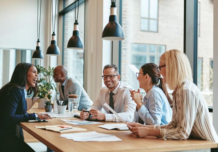 Group of people around a table discussing an issue