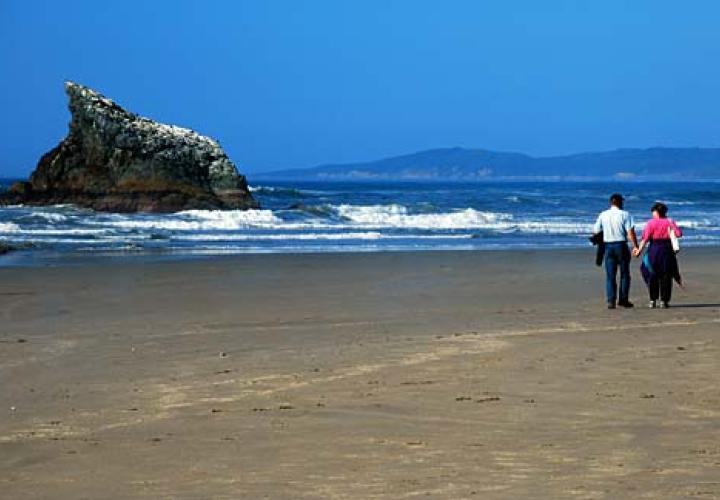 People walking on the beach in Coos Bay OR