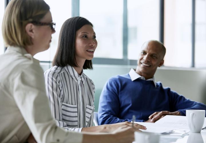 Diverse group of people working at table