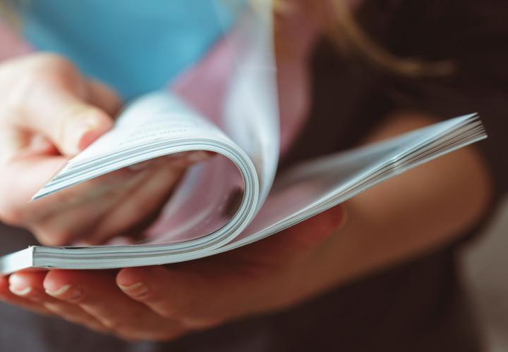 Person reading a booklet