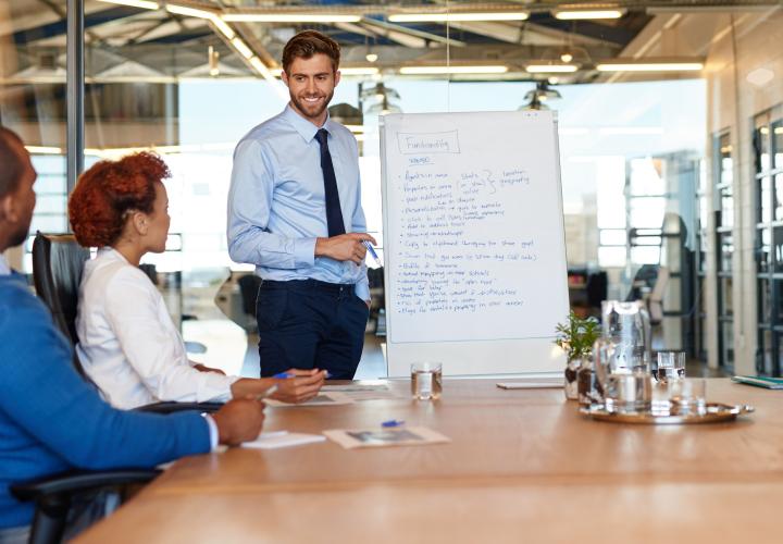 Group of people listening to a facilitator