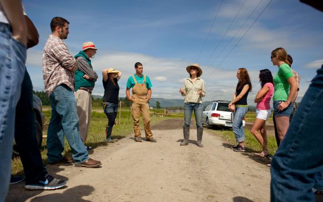 Group of students being taught in the field