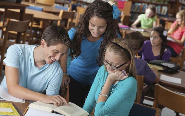 High schoolers in library