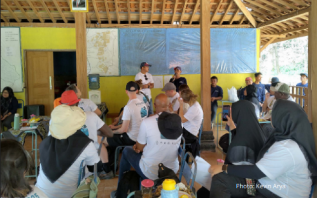 A group of ECCR students focused toward the front of a classroom in Indonesia