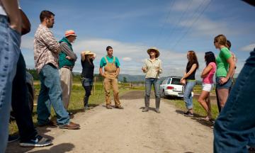 Group of students being taught in the field