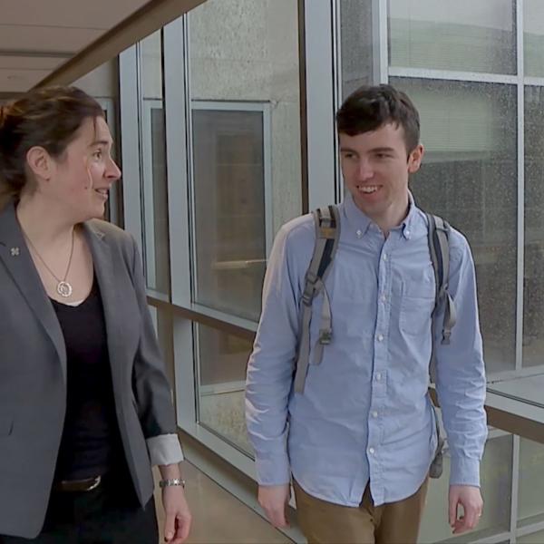 Dr. Melody Valdini meeting with student