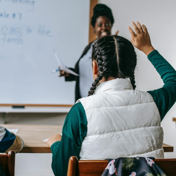 student raising hand