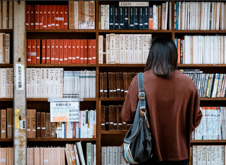 student in library