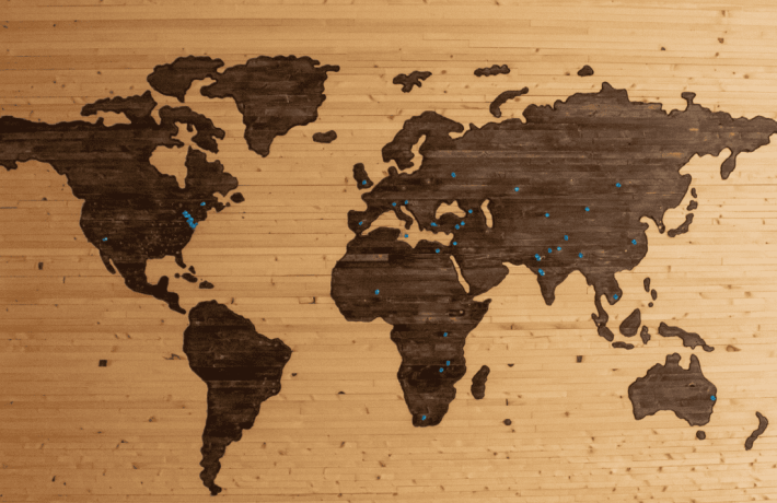 wood world map with pins