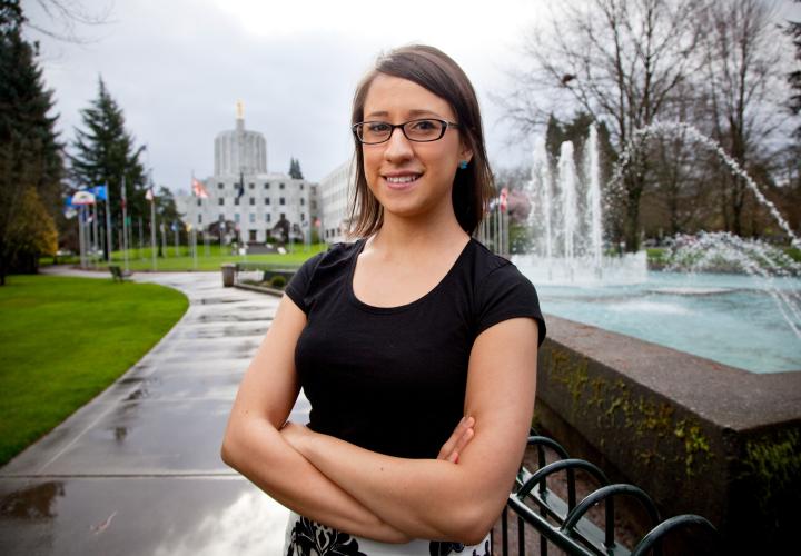 student in front of state capitol