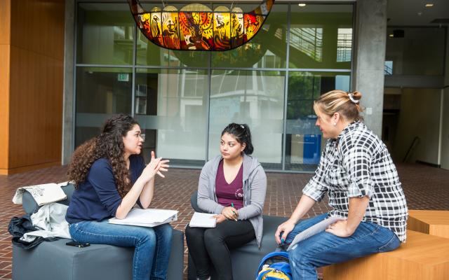 students talking in the rec center lobby