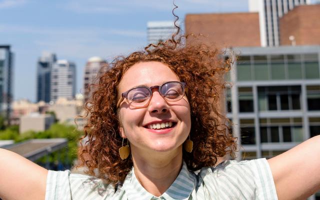 PSU pre-optometry student relaxing on a rooftop terrace
