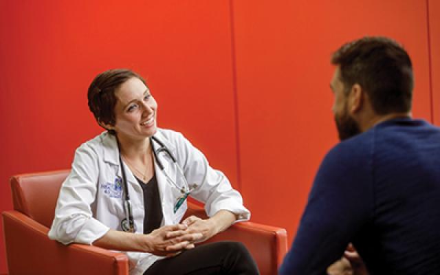A doctor meeting with a patient