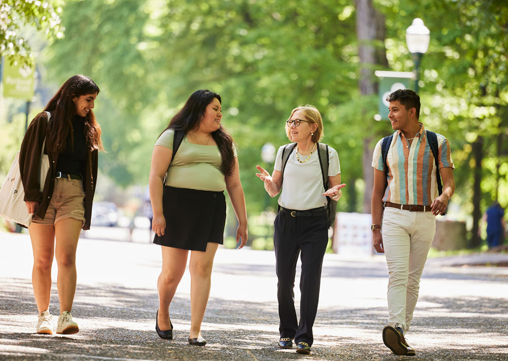 President Cudd walking with students