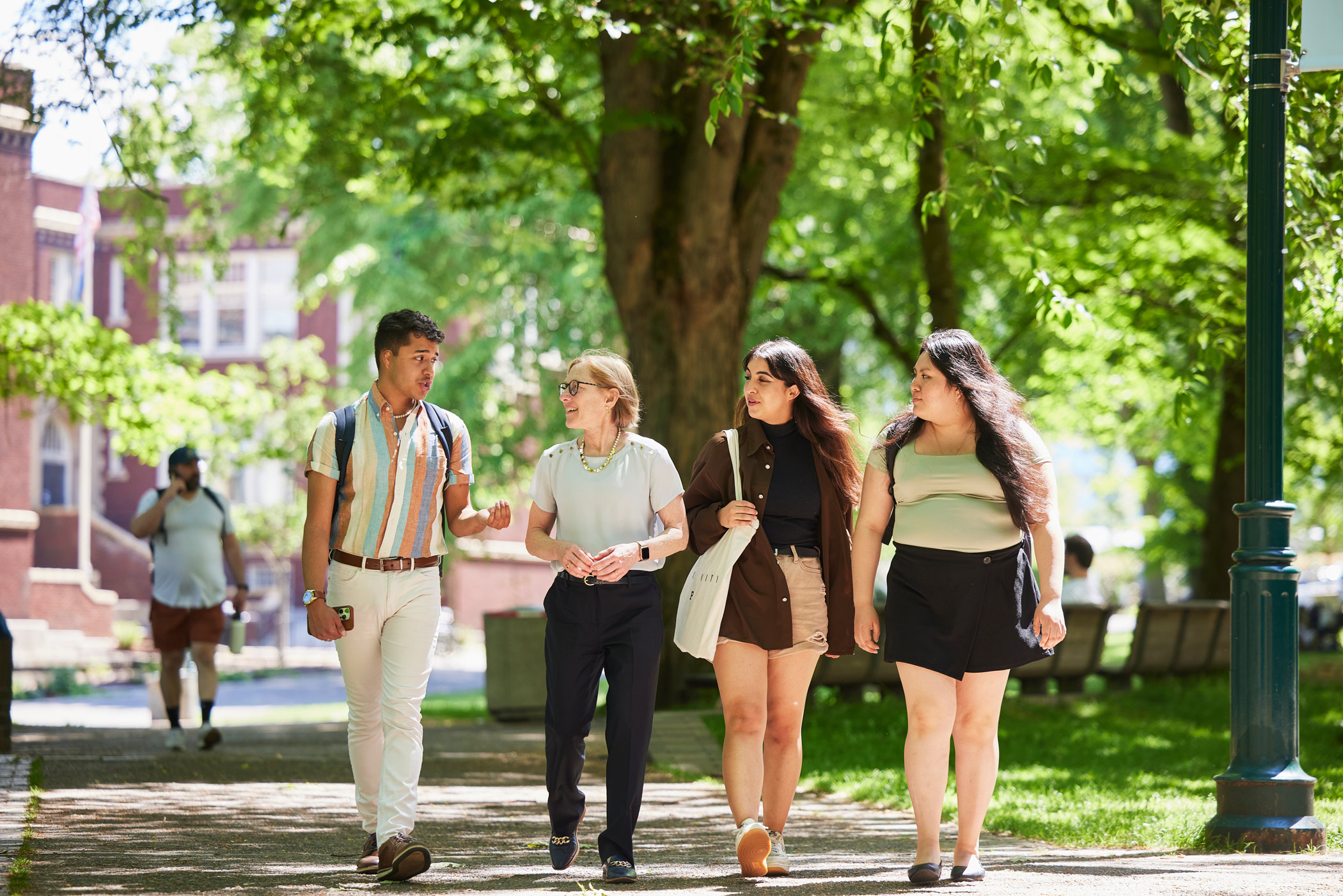 Ann Cudd walking with students