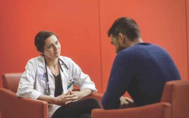 Doctor talking with patient
