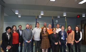 A group of PSU veterans posing with Congresswoman Suzanne Bonamici 