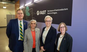 UO President Shulz, OSU President Murthy, Oregon Gov. Kotek and PSU President Cudd standing together in front of the FAST logo. 