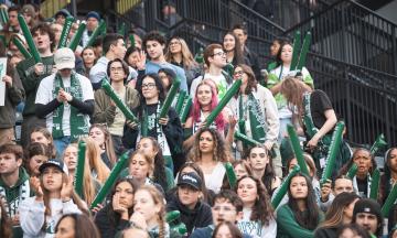 PSU student and other fans in the stands at the PSU Homecoming game at Providence Park in November 20025.  