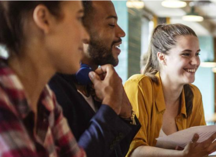 People smiling in a meeting