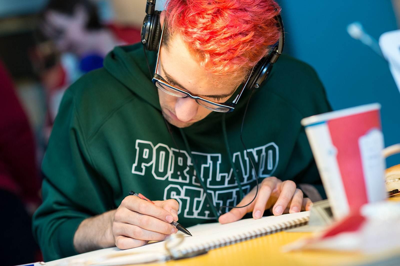 PSU online student studying in coffee shop
