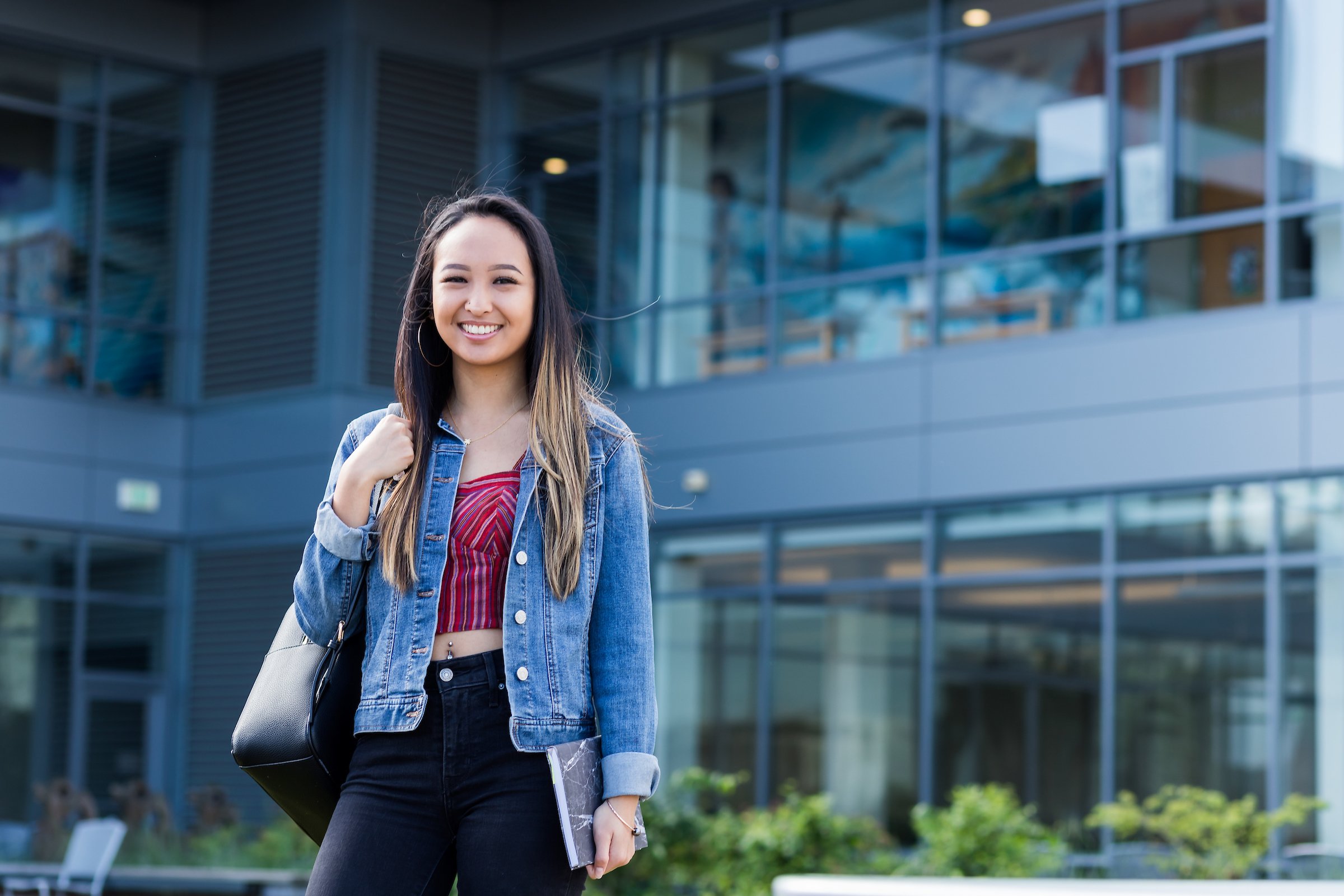 PSU Online student standing in front Recreation Center