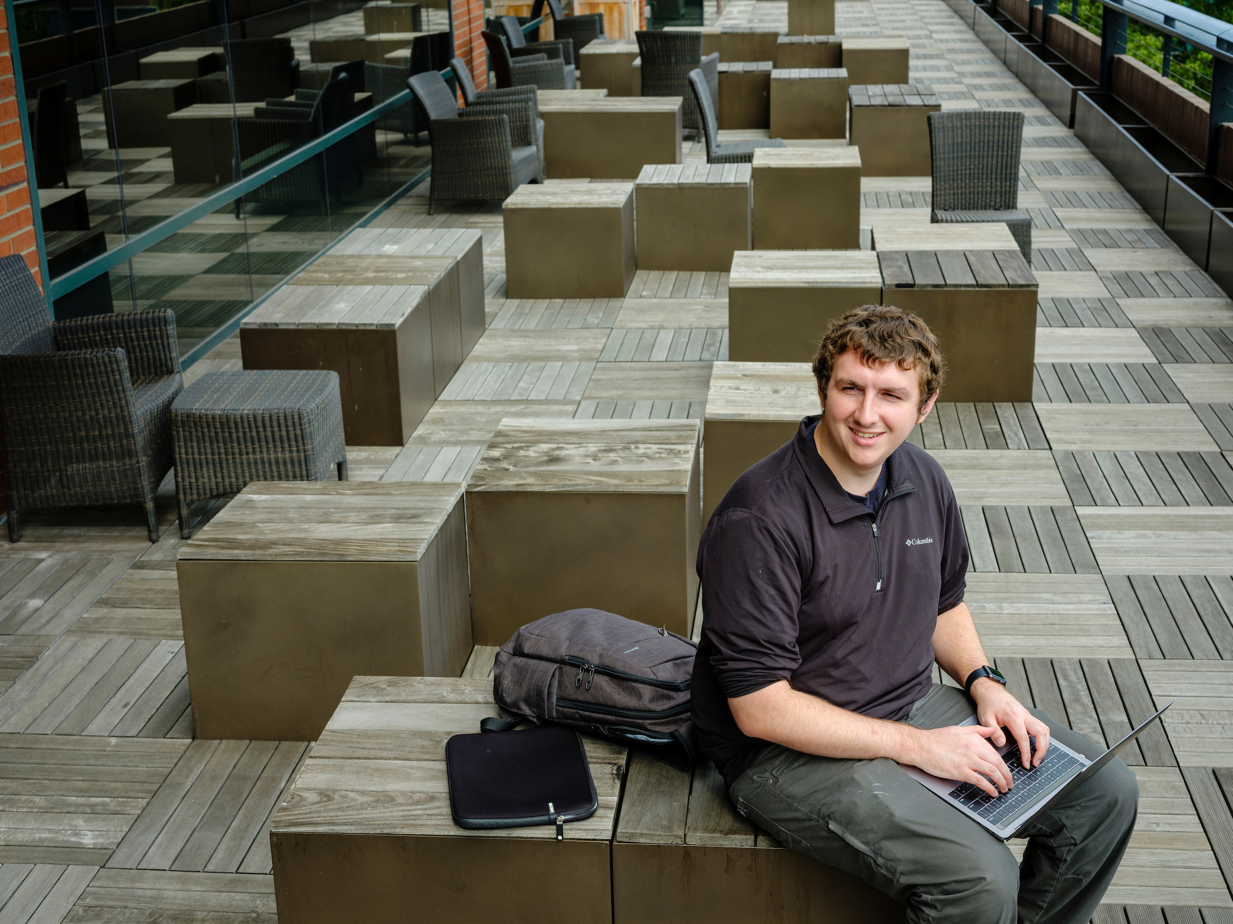 PSU online student studying in lobby
