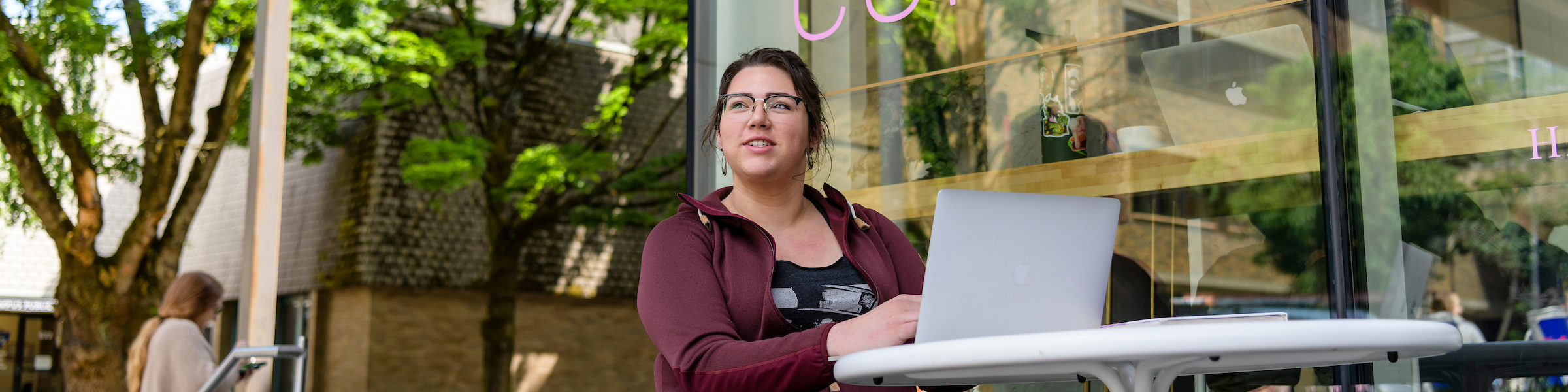 PSU student studying in front of donut shop