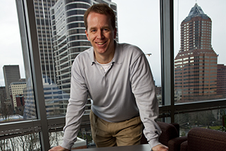 PSU online Faculty in his office