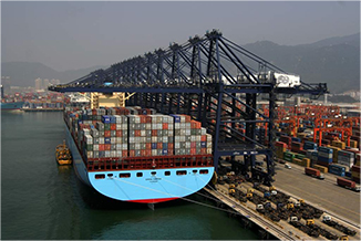 Cargo barge being loaded at port