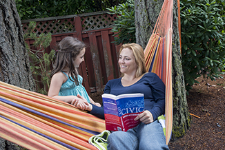 PSU online student studying at home with her daughter