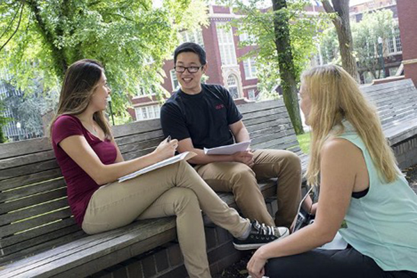 three psu online students studying in the park