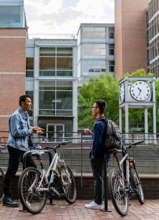 Students with bikes taking together in PSUUrban Plaza