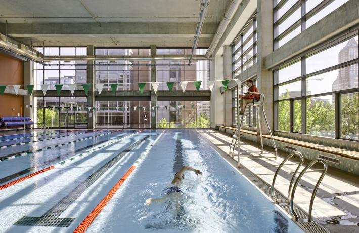 Lap Swimmer and Lifeguard at Rec Center Pool 