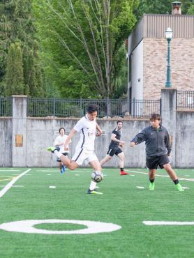 Soccer players on Stott Field