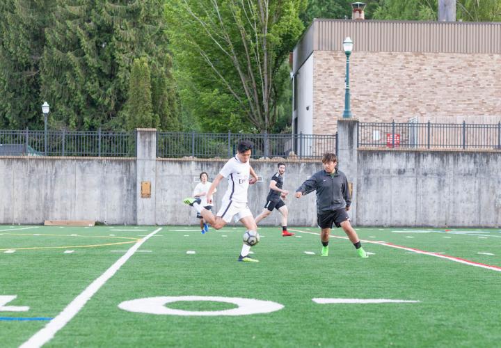 Soccer players on Stott Field