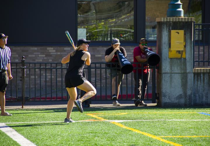 Women ready to swing softball bat. 