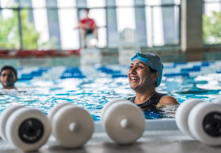 Person swimming in pool.