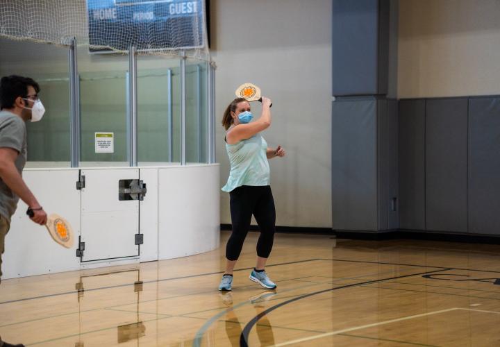 A doubles team playing pickleball