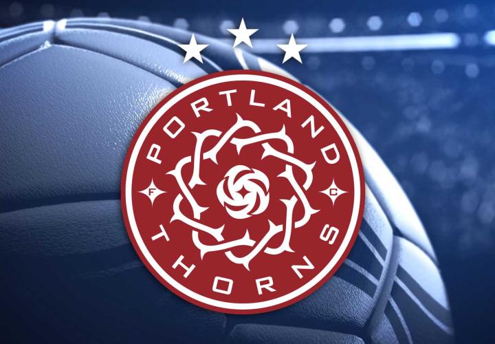 Portland Thorns logo with a soccer ball in the background